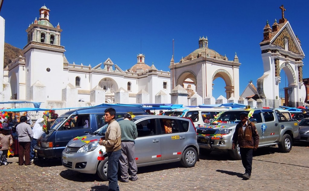 Cars waiting to be blessed outside the Basilica
